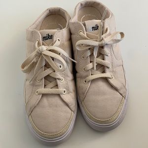 Tan Nike slip ons